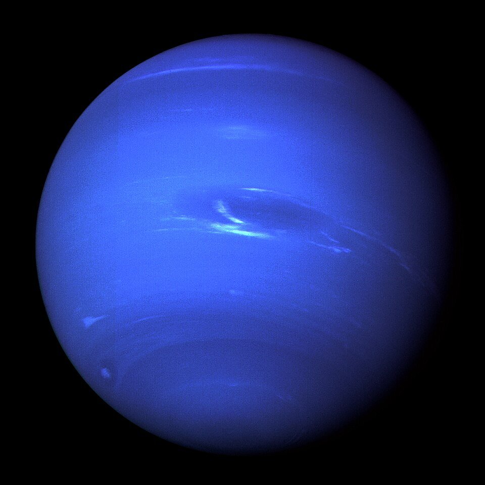 A deep blue planet against black space, with faint white cloud streaks and a dark oval storm.