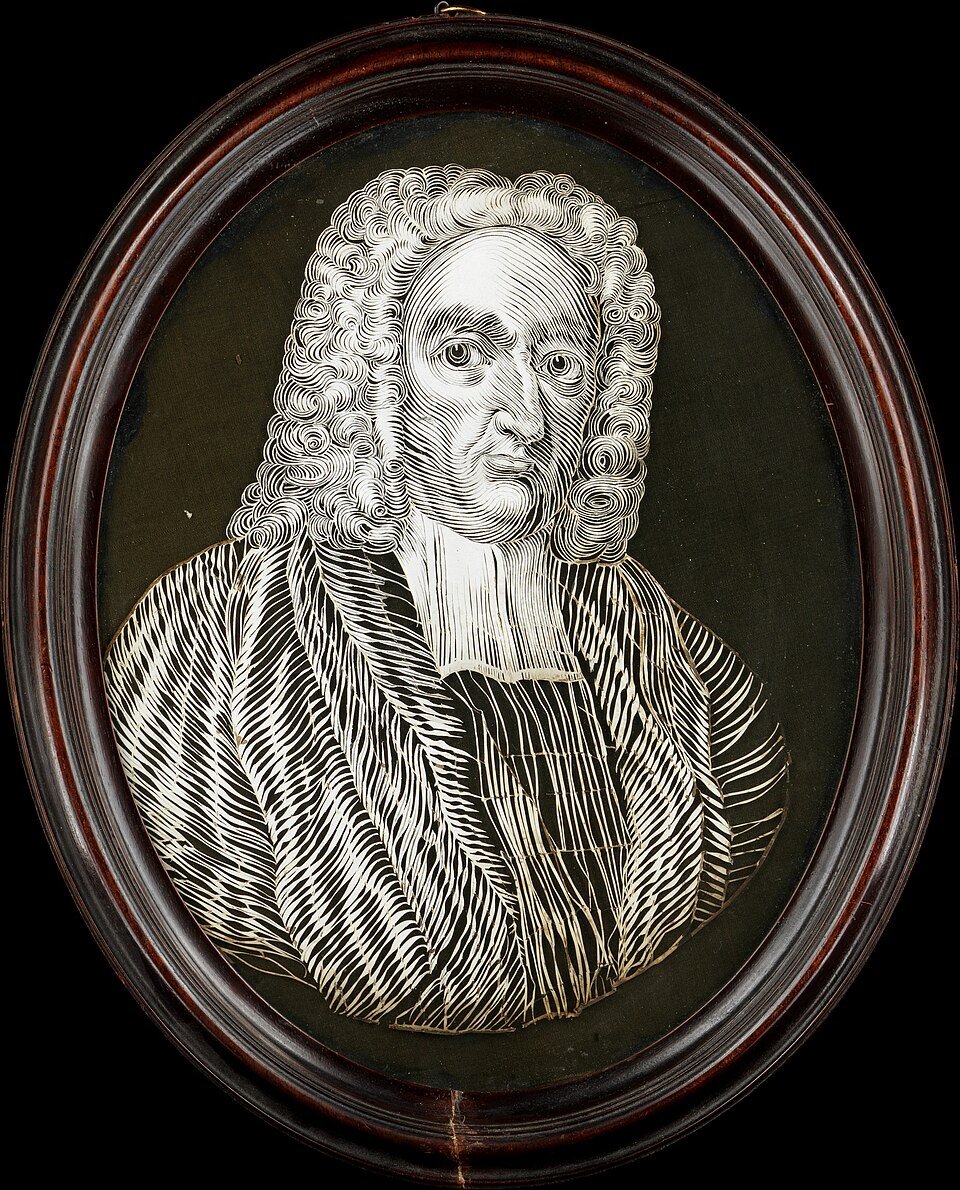 An oval framed relief portrait in white of a man in a long curled wig and clerical bands, set against a dark background.