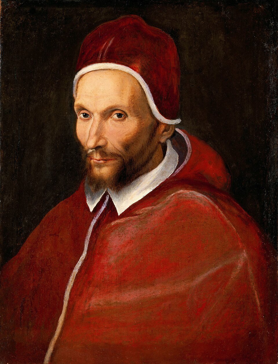 A painted portrait of a thin bearded man in a red velvet cap and red shoulder cape against a dark background.